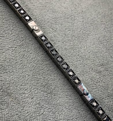 Pulso en tejido Tennis con Diamantes negros (250pts) en Oro 18K 30.85gr